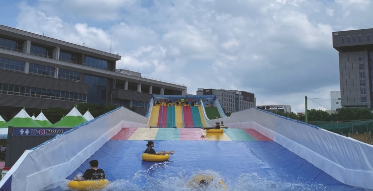 Visitors enjoying the 80m water slide